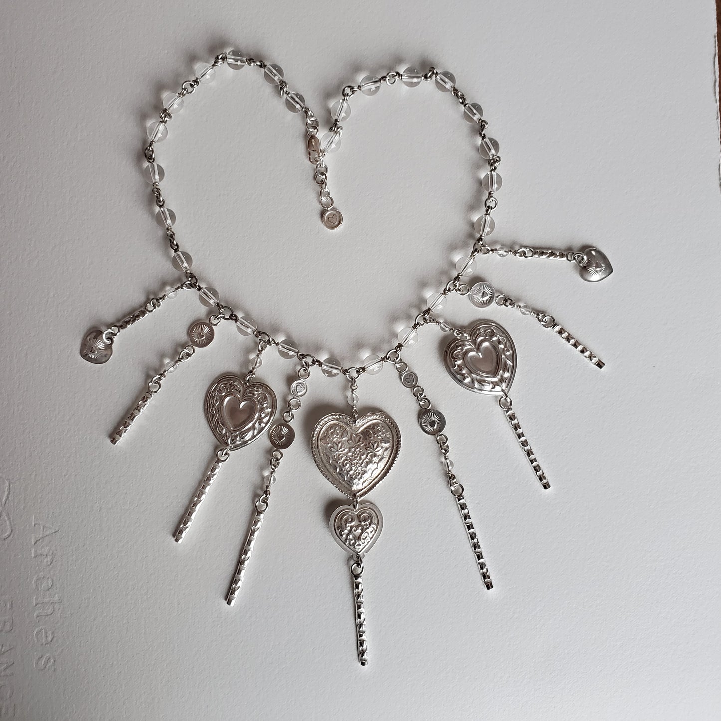 Radiate your Love with this mithril like necklet full of bursting heart and romantic lace. This item is entirely handmade from Argentium Silver which holds its luster better than sterling silver.