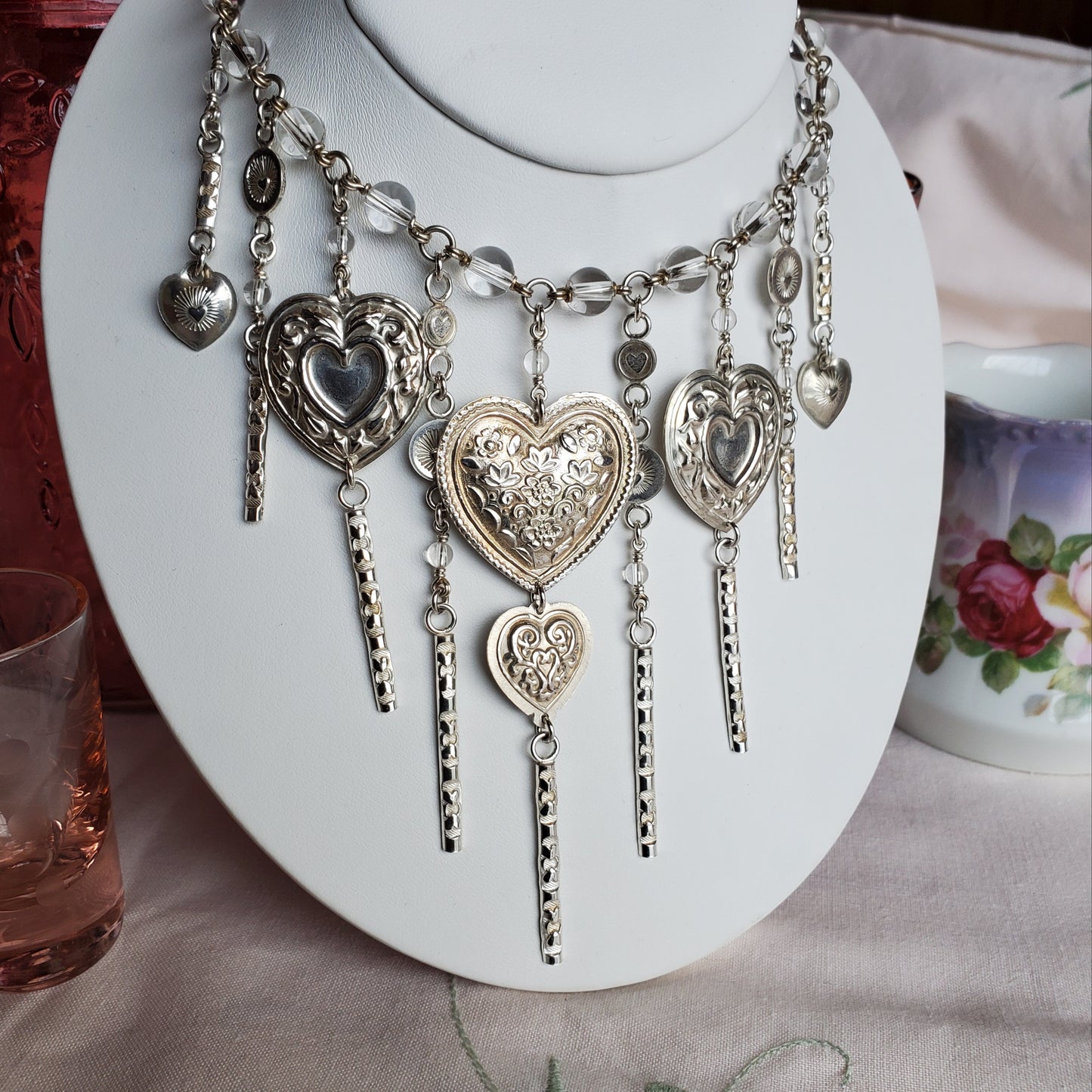 A joyous feeling arises when adorned with this piece. Bursting with Love, the quartz beads are beautifully clean and clear. The silver tassels make a sweet song as if you are wearing a wind chime.